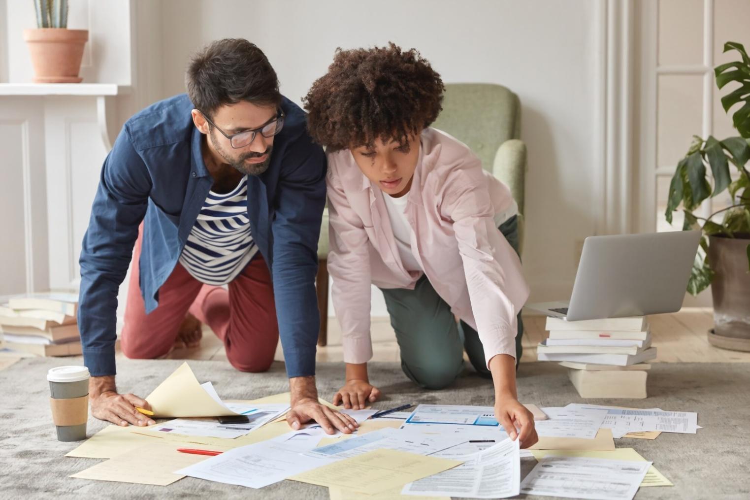 Financial analysis workspace with data charts and research materials